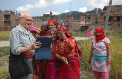 Traveler interacting with women while visiting Panauti community homestay